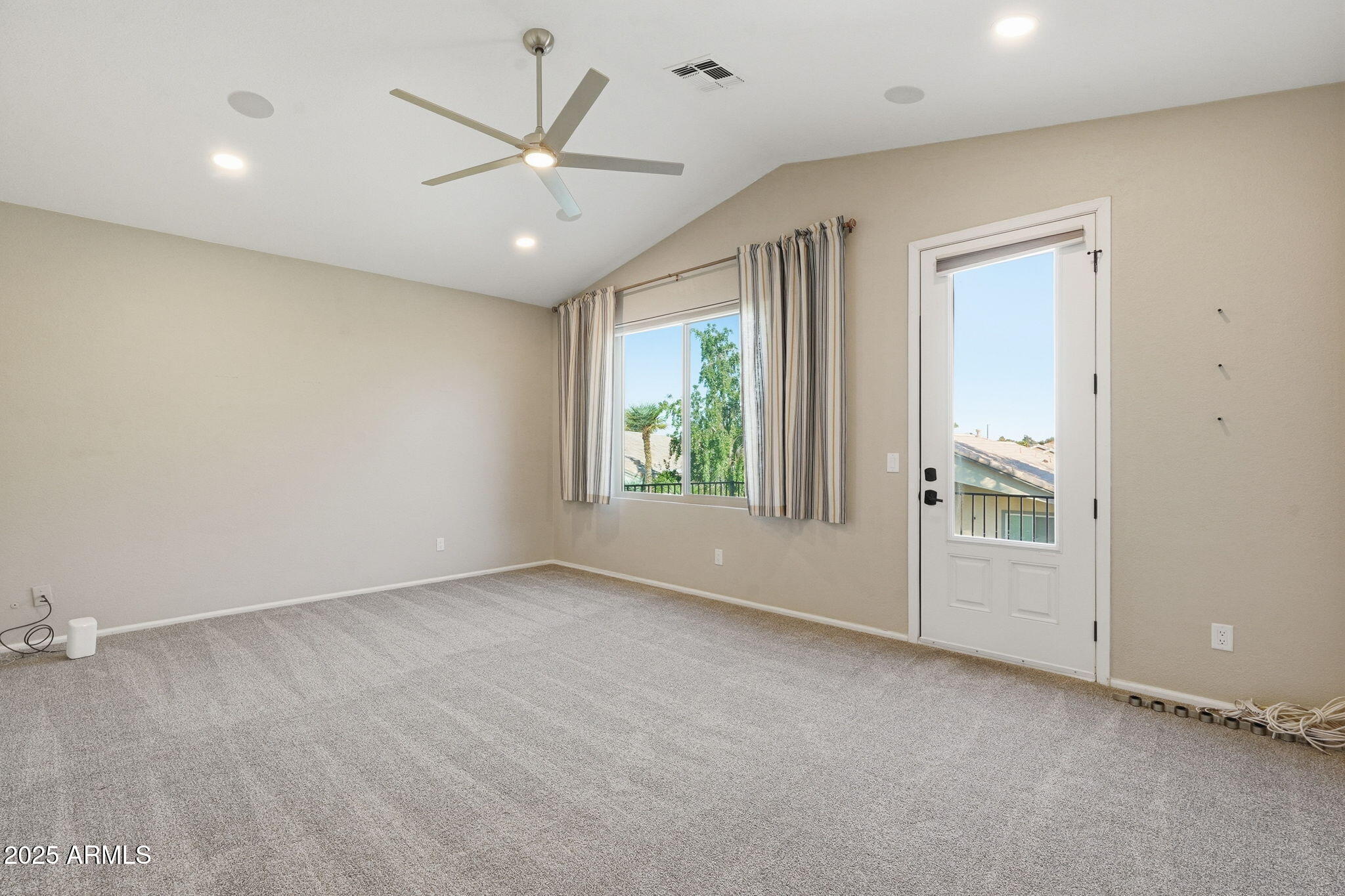 245 West Sagebrush Street Gilbert, AZ 85233 - Photo 34 of 62 an empty room with windows and ceiling fan