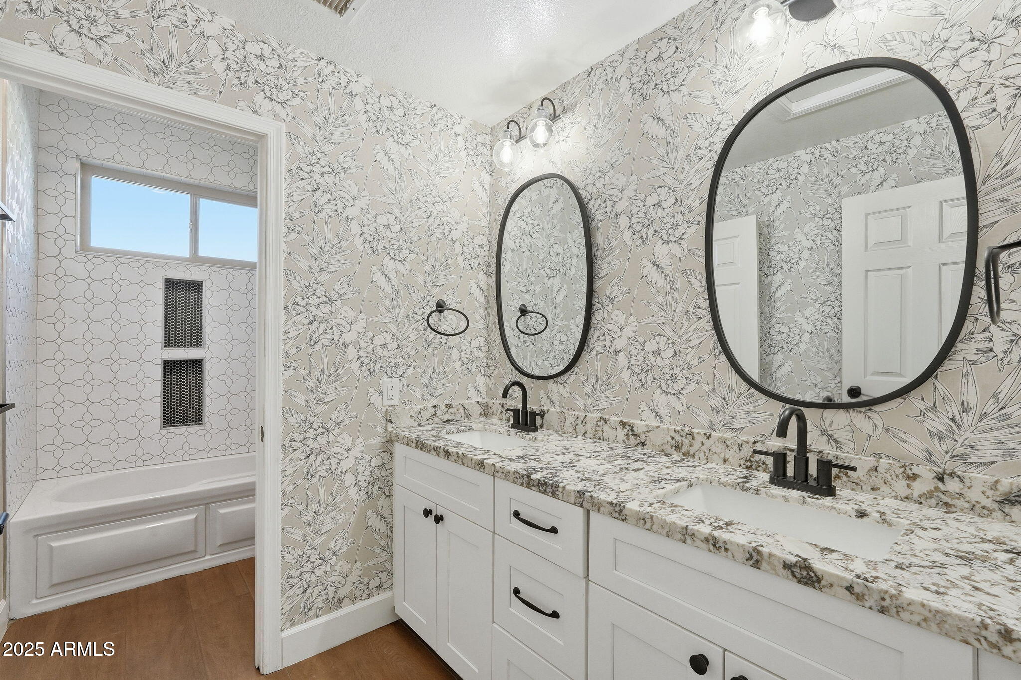 245 West Sagebrush Street Gilbert, AZ 85233 - Photo 35 of 62 a bathroom with a granite countertop sink and a mirror