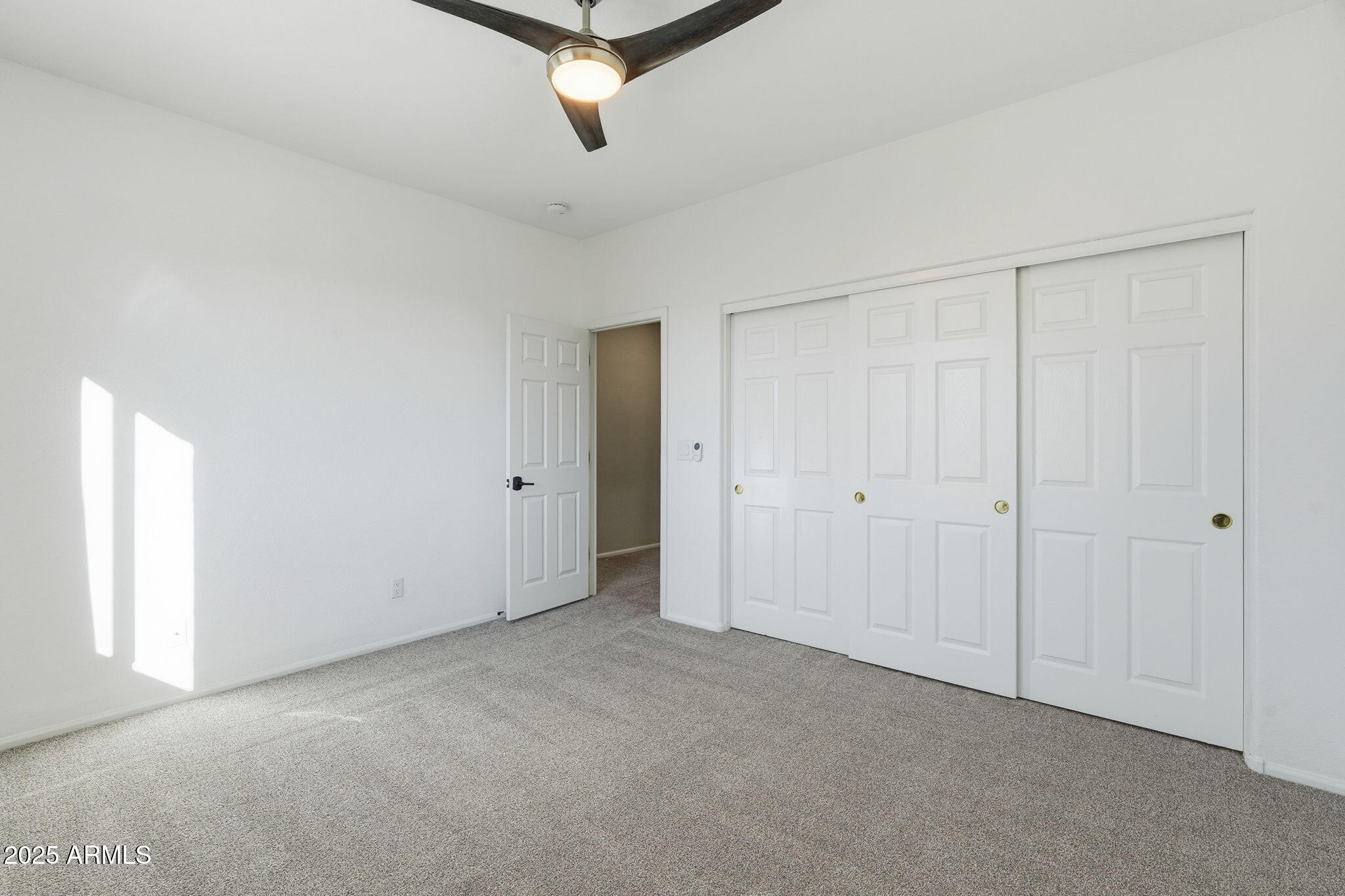 245 West Sagebrush Street Gilbert, AZ 85233 - Photo 38 of 62 a view of a livingroom with an empty space and a window