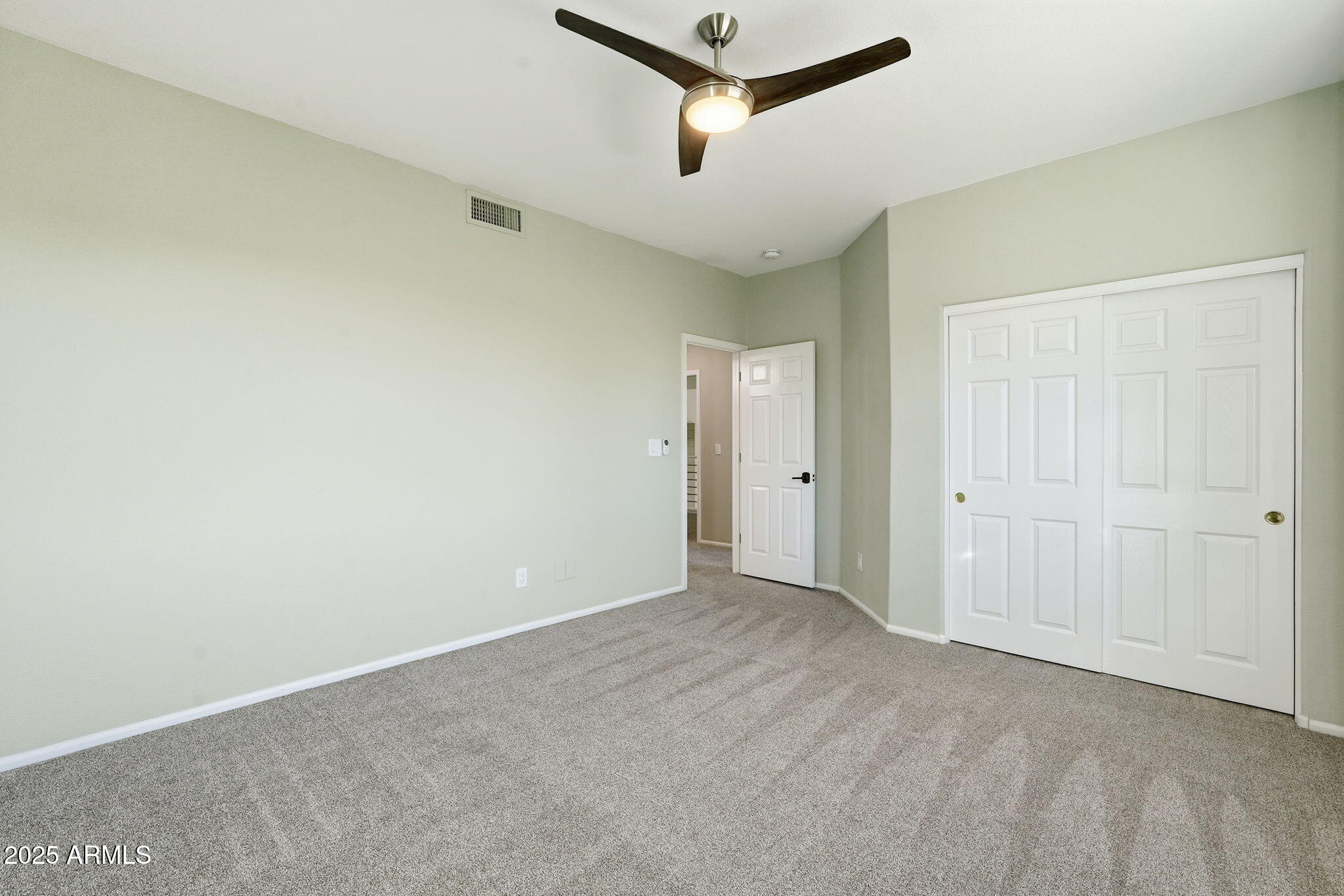 245 West Sagebrush Street Gilbert, AZ 85233 - Photo 40 of 62 a view of a room with a ceiling fan