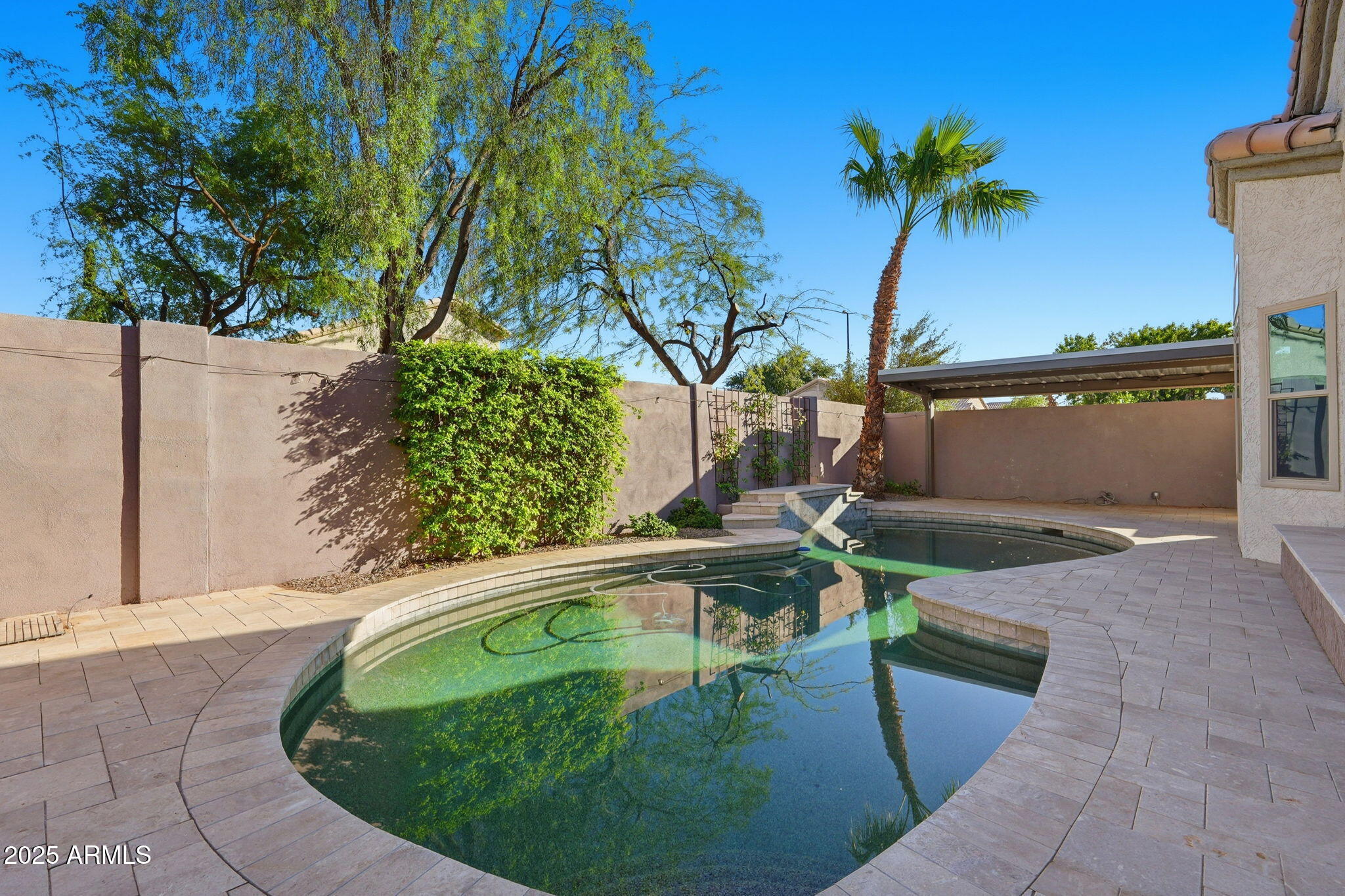 245 West Sagebrush Street Gilbert, AZ 85233 - Photo 45 of 62 a swimming pool with outdoor seating and yard