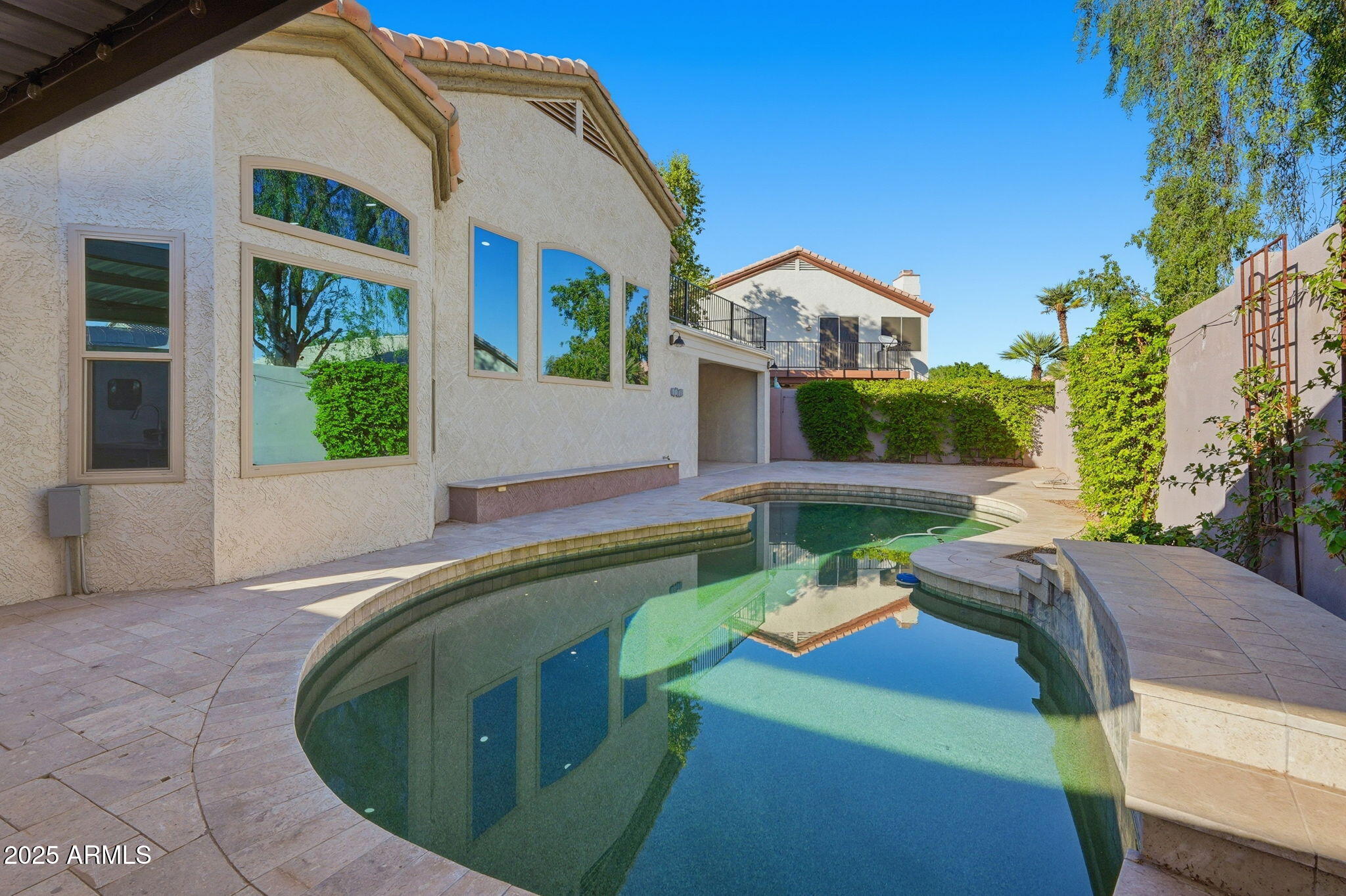 245 West Sagebrush Street Gilbert, AZ 85233 - Photo 49 of 62 a view of a house with roof deck and sitting area