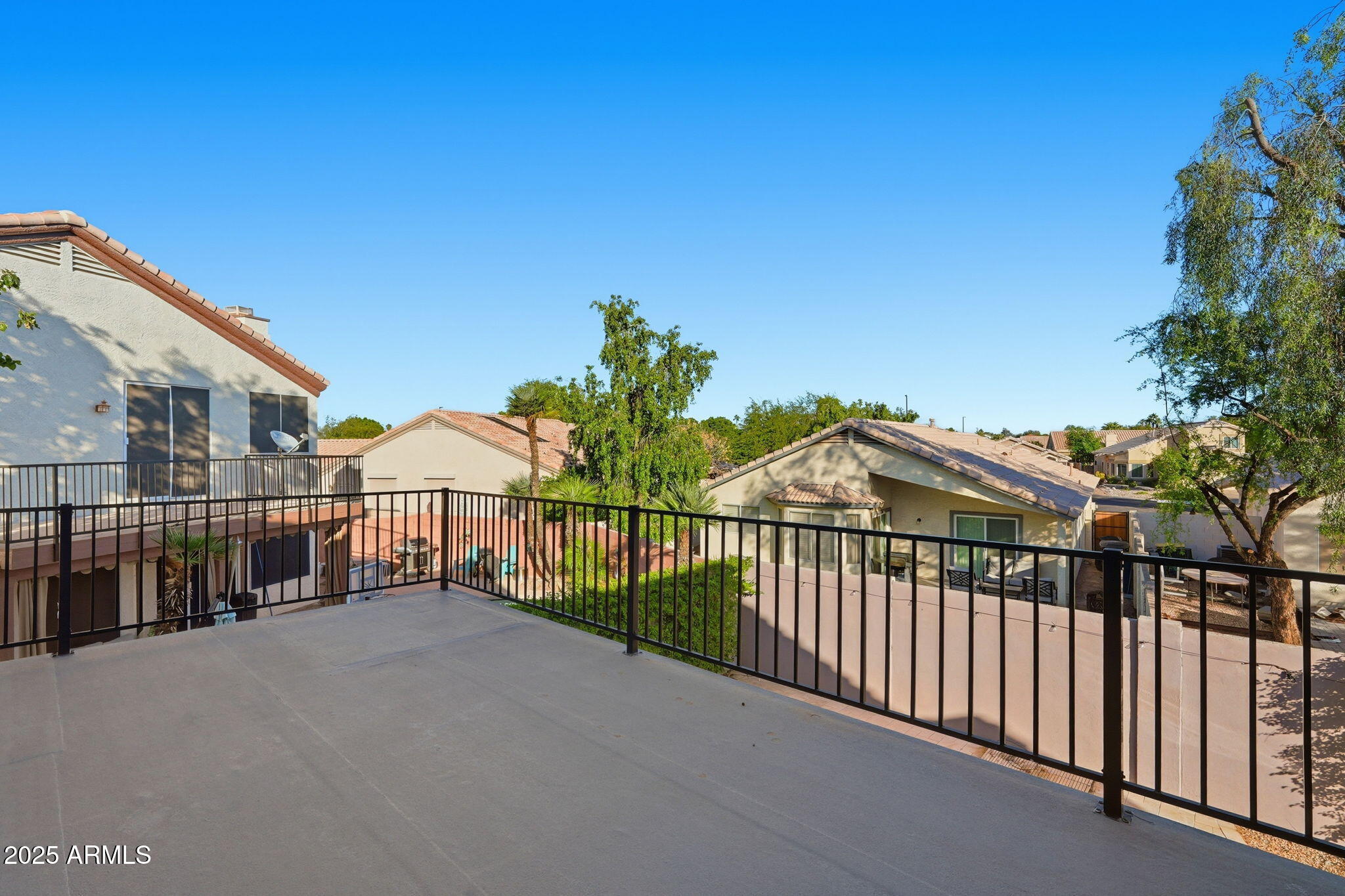 245 West Sagebrush Street Gilbert, AZ 85233 - Photo 52 of 62 a view of a house with a wooden fence