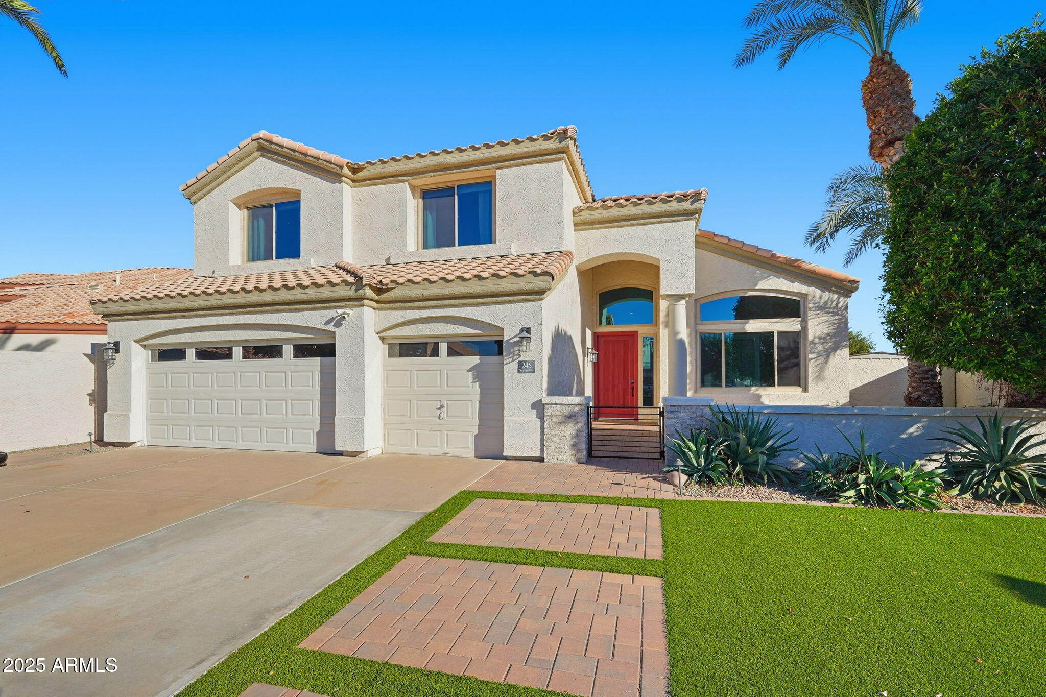 245 West Sagebrush Street Gilbert, AZ 85233 - Photo 62 of 62 a front view of a house with a yard and garage