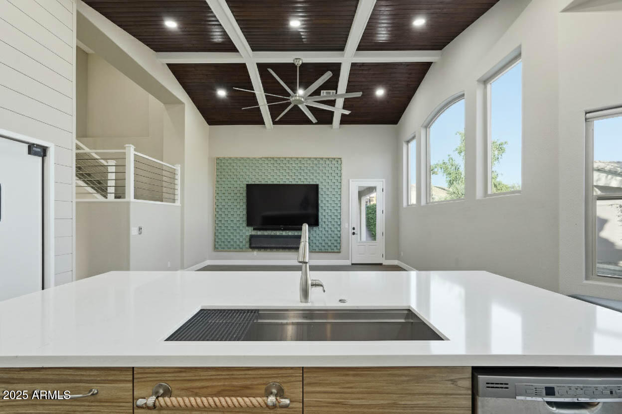 245 West Sagebrush Street Gilbert, AZ 85233 - Photo 8 of 62 a view of a kitchen with a sink and a microwave