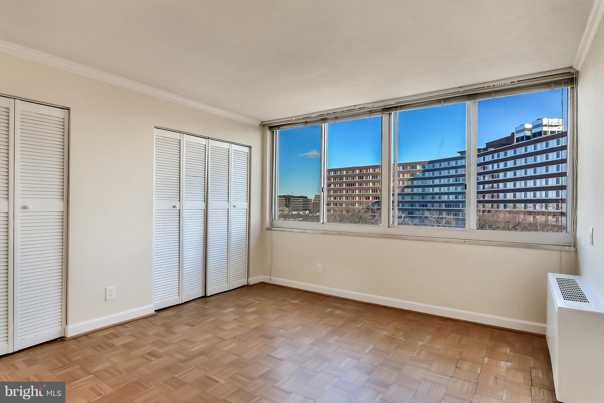 1301 South Arlington Ridge Road, Unit 406 Arlington, VA 22202 - Photo 13 of 27 a view of an empty room with a window