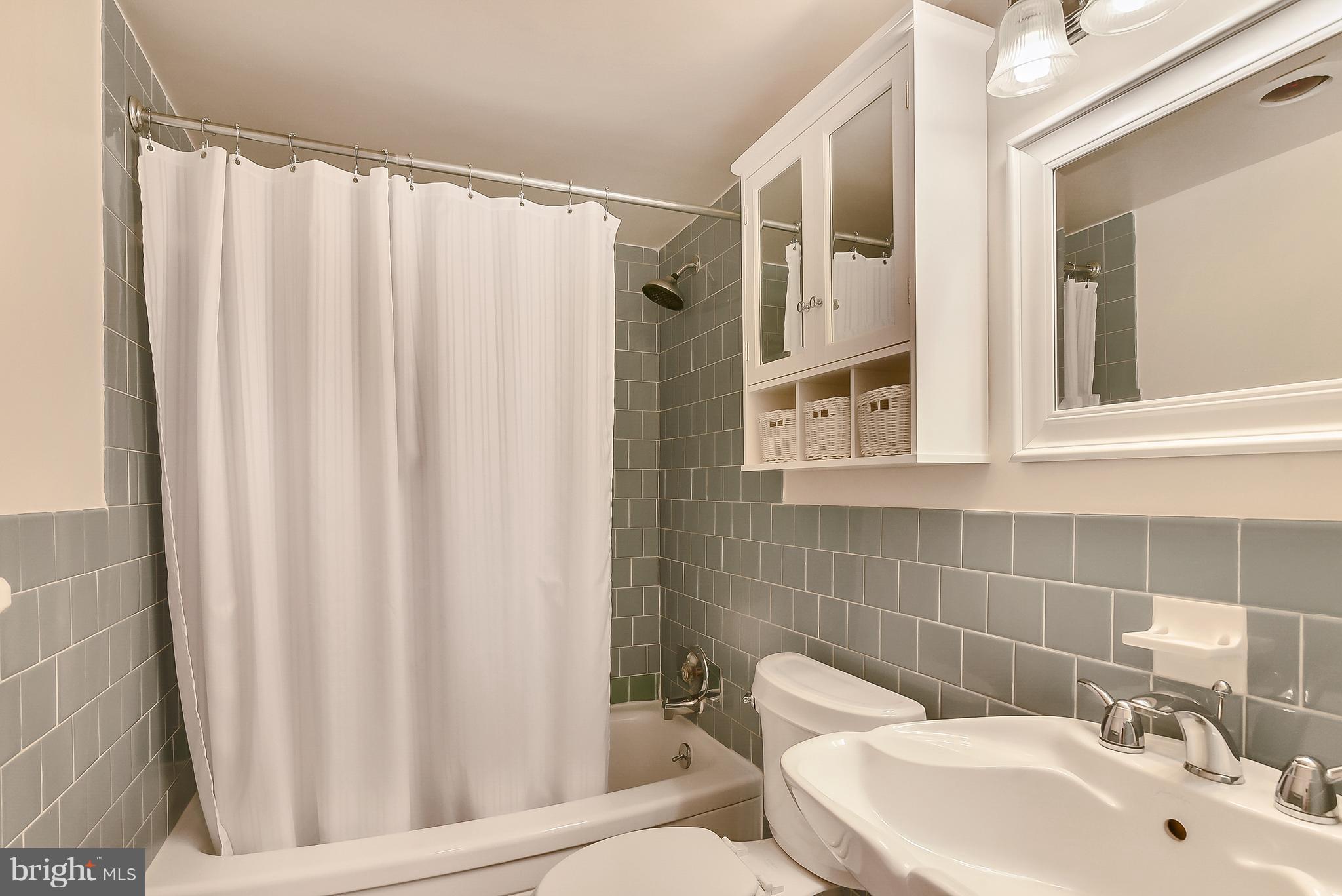 1301 South Arlington Ridge Road, Unit 406 Arlington, VA 22202 - Photo 15 of 27 a bathroom with a sink and toilet
