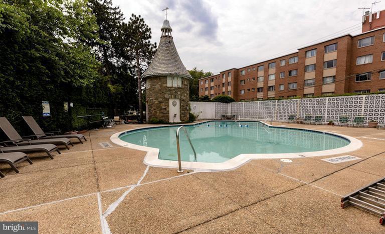 1301 South Arlington Ridge Road, Unit 406 Arlington, VA 22202 - Photo 19 of 27 a view of a swimming pool with a patio