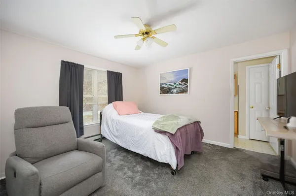 a bedroom with a bed and a couch