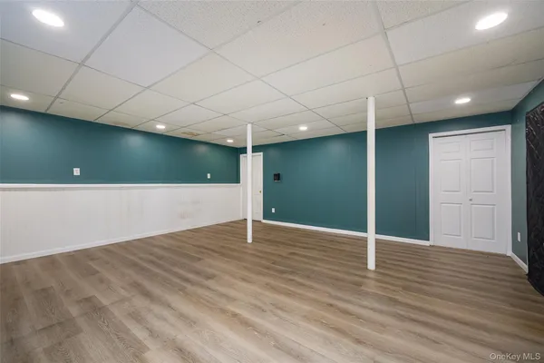 an empty room with wooden floor