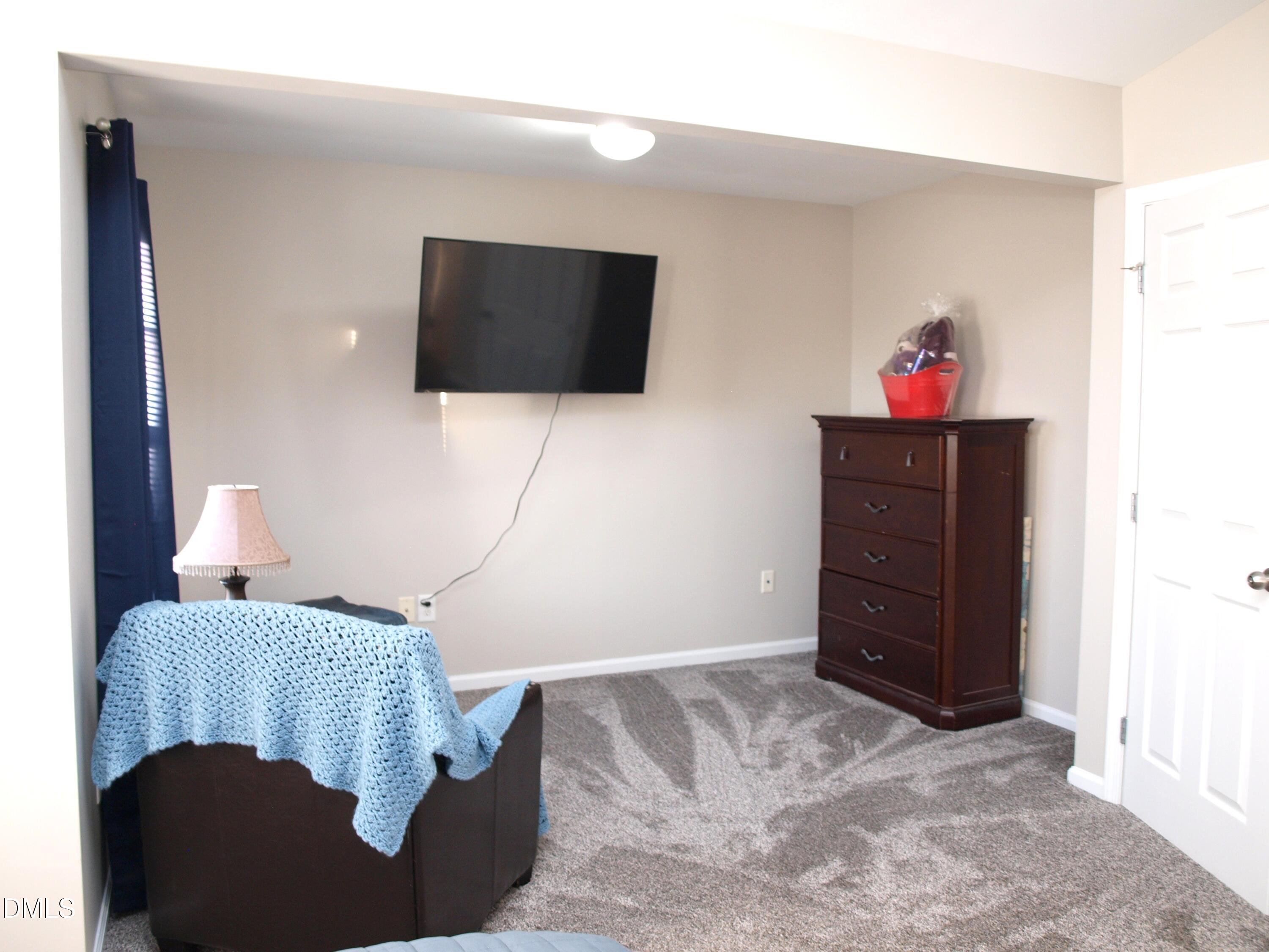 2019 Tennessee Road Durham, NC 27704 - Photo 12 of 21 a living room with furniture and a flat screen tv