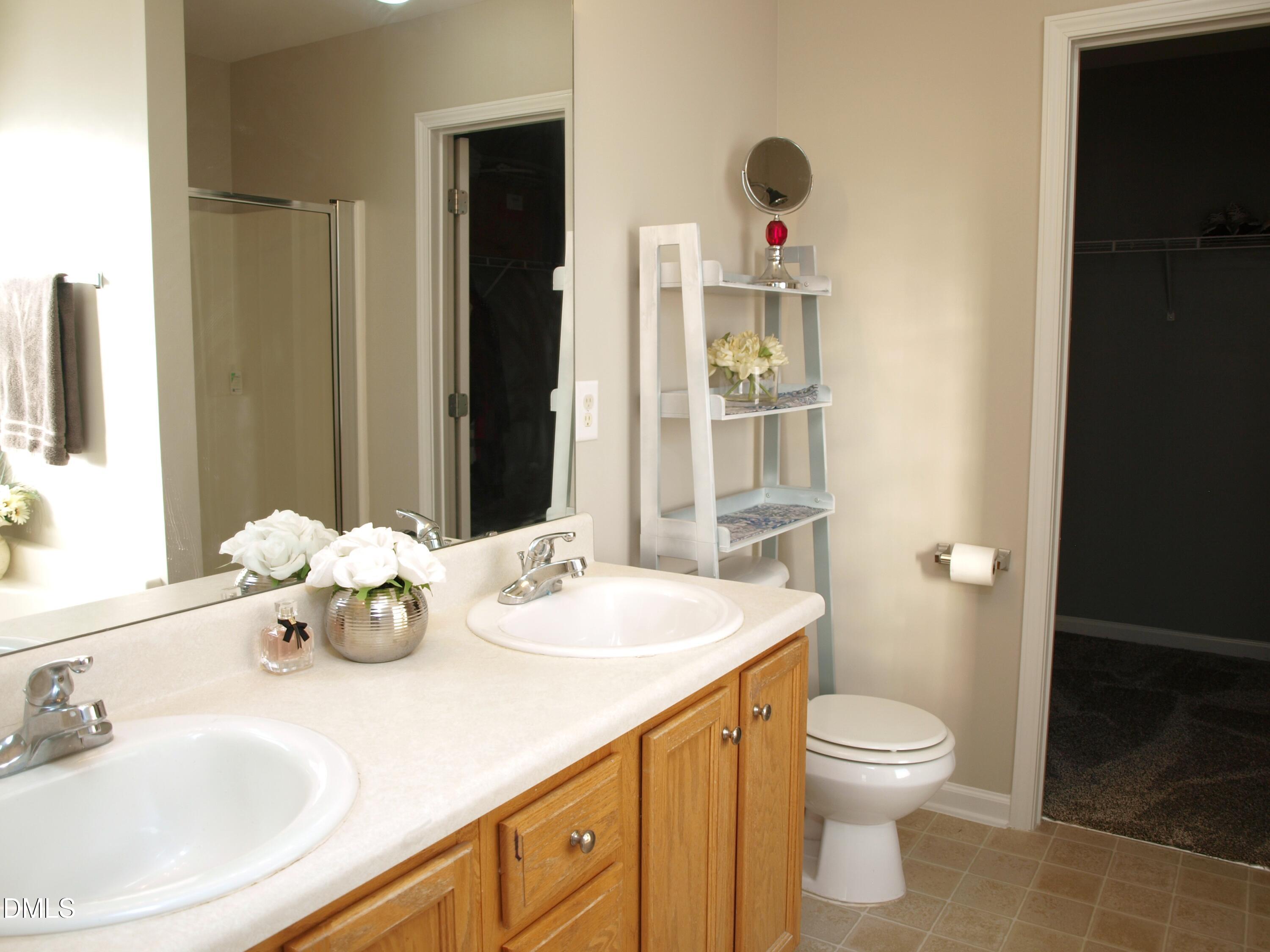 2019 Tennessee Road Durham, NC 27704 - Photo 13 of 21 a bathroom with a sink a toilet and shower