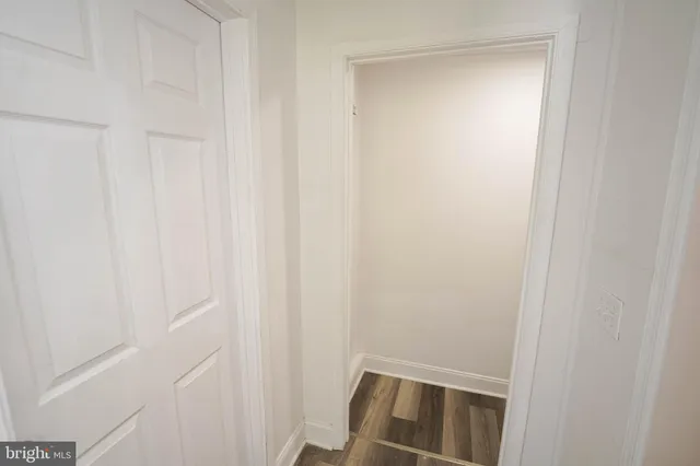 a view of utility room with wooden floor