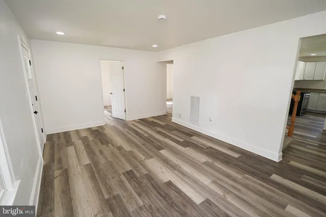 a view of room with wooden floor