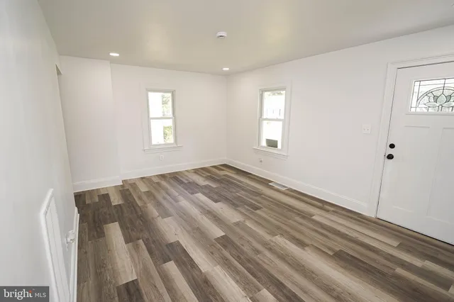 a view of room with window and hardwood floor