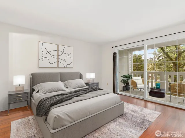 a bedroom with a large bed and a large window