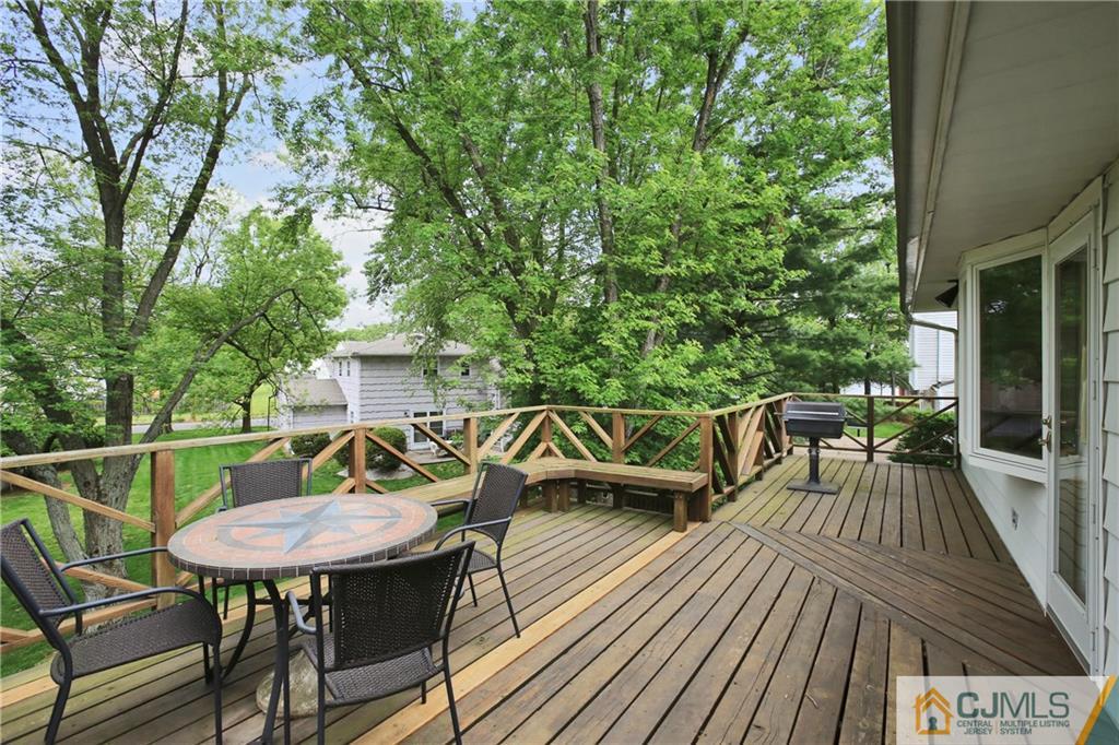 3 Eagle Road Edison, NJ 08820 - Photo 22 of 25 a balcony with wooden floor table and chairs
