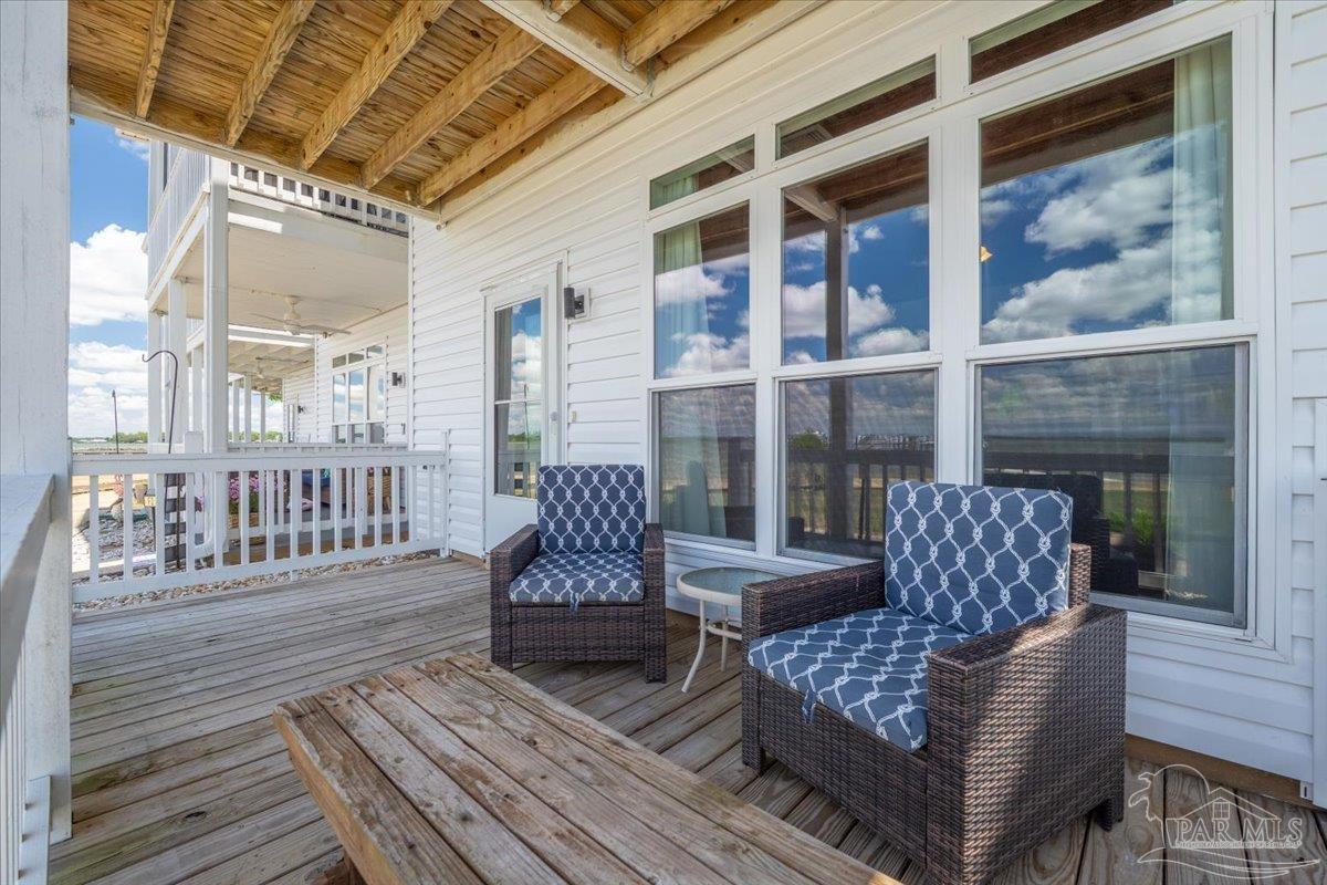 26063 Canal Road, Unit 3F Orange Beach, AL 36561 - Photo 12 of 72 a outdoor living space with furniture and a fireplace