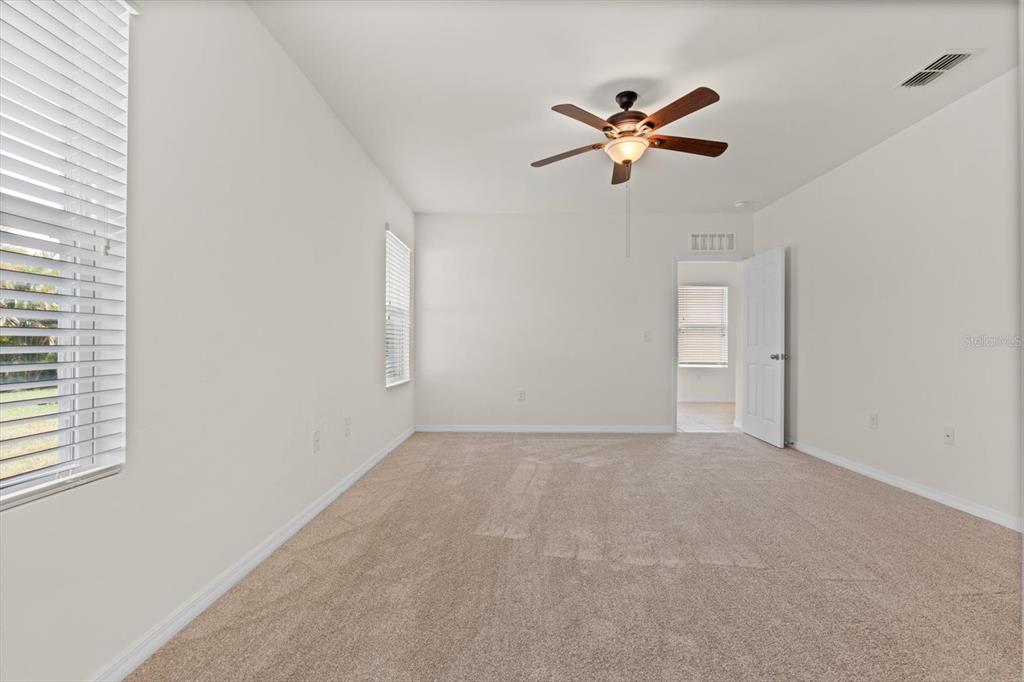 8932 Excelsior Place Venice, FL 34293 - Photo 17 of 43 a view of a livingroom with a ceiling fan and window