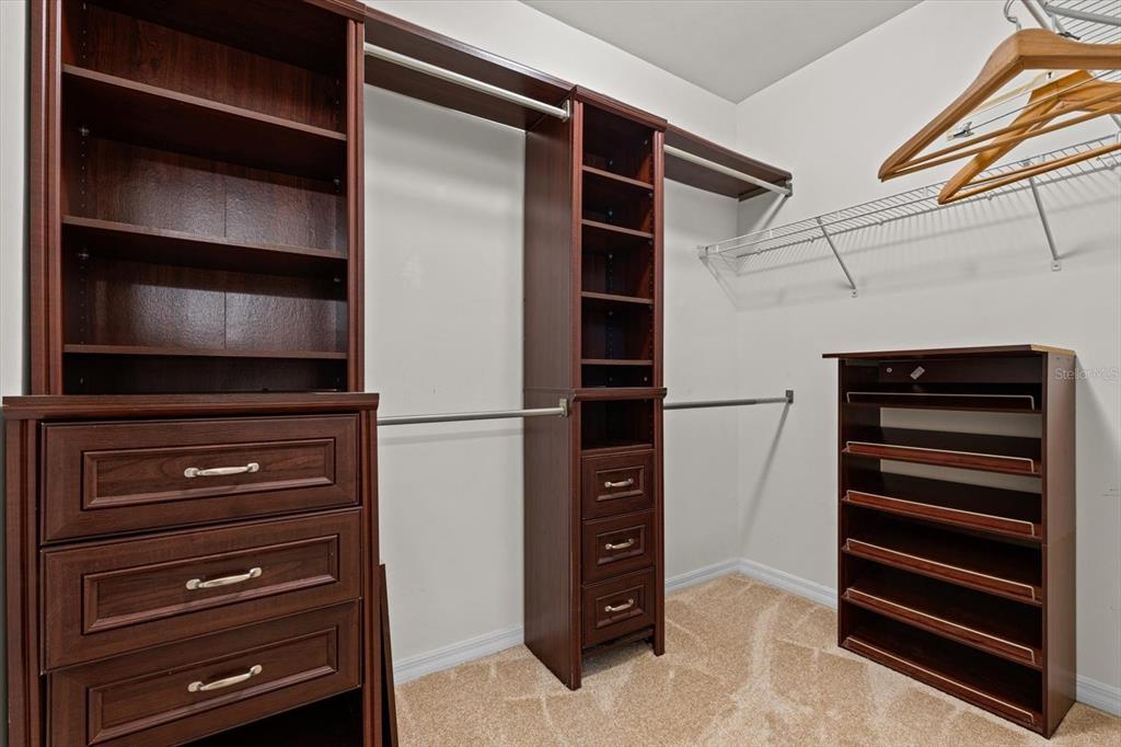 8932 Excelsior Place Venice, FL 34293 - Photo 20 of 43 a view of walk in closet with empty racks