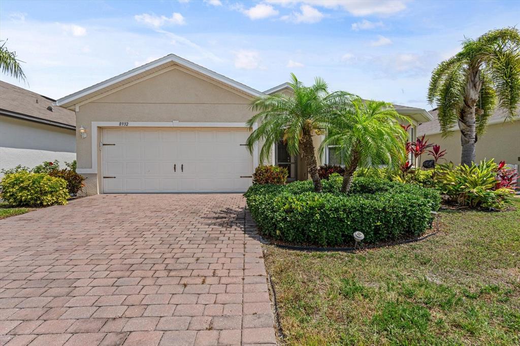 8932 Excelsior Place Venice, FL 34293 - Photo 2 of 43 a front view of a house with a yard