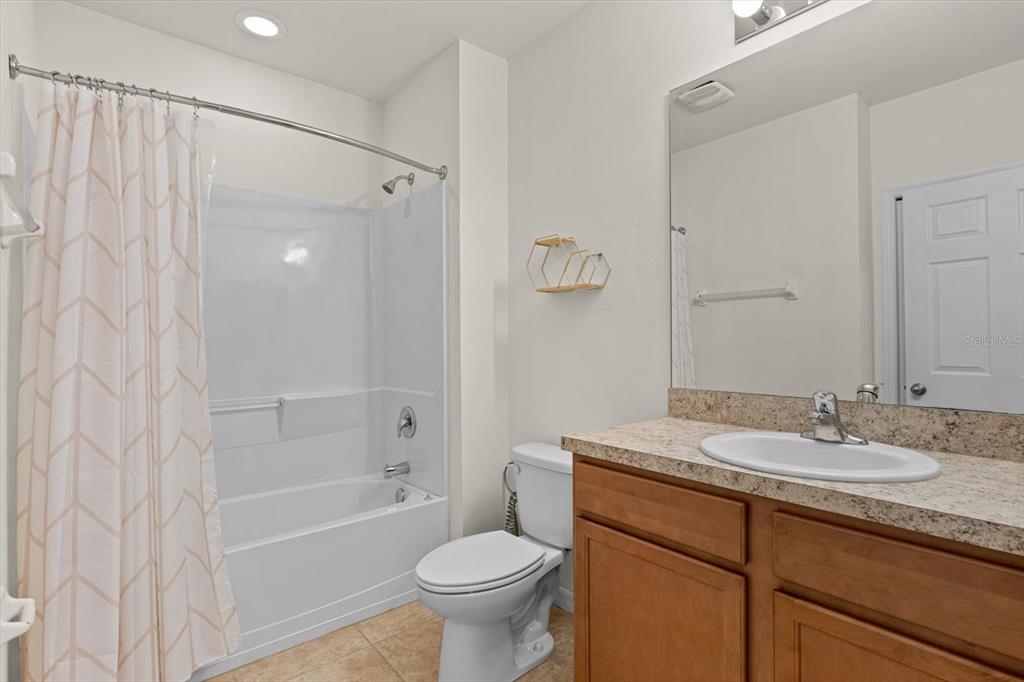 8932 Excelsior Place Venice, FL 34293 - Photo 24 of 43 a bathroom with a sink toilet and shower