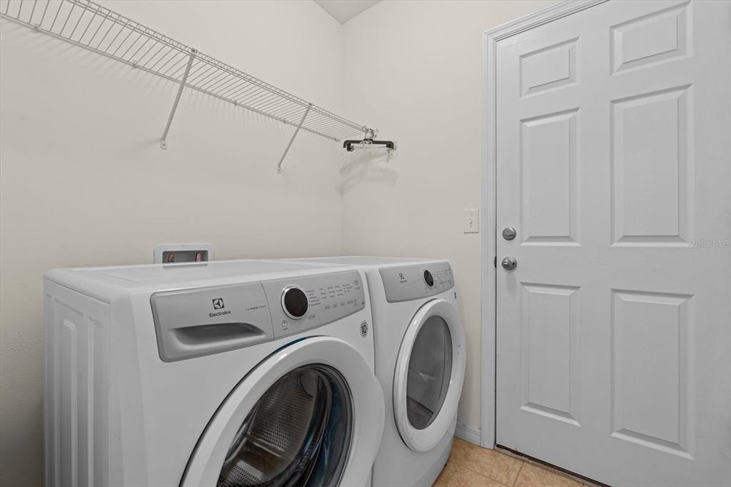 8932 Excelsior Place Venice, FL 34293 - Photo 28 of 43 a utility room with dryer and washer