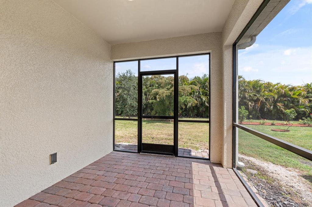 8932 Excelsior Place Venice, FL 34293 - Photo 30 of 43 a view of empty room with balcony and floor to ceiling window