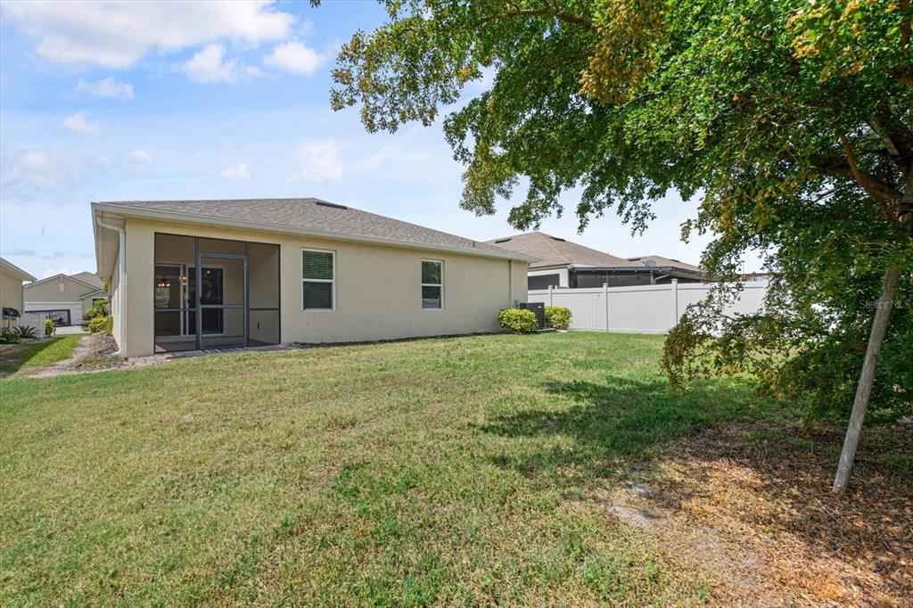 8932 Excelsior Place Venice, FL 34293 - Photo 35 of 43 a front view of a house with garden