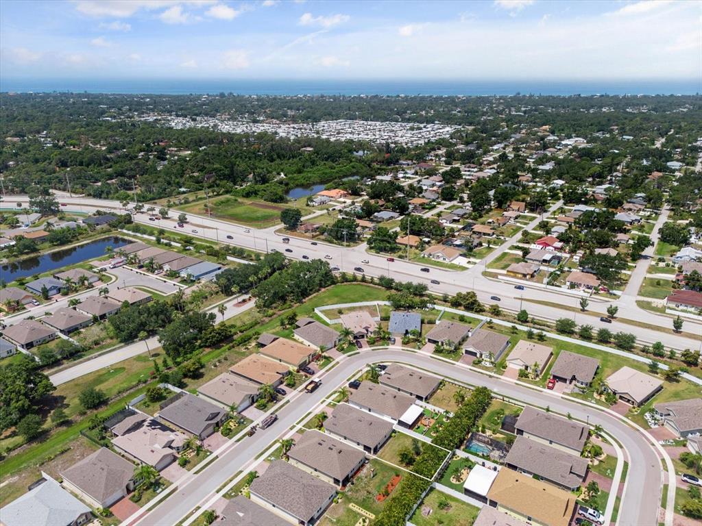 8932 Excelsior Place Venice, FL 34293 - Photo 38 of 43 an aerial view of a city with lots of residential buildings