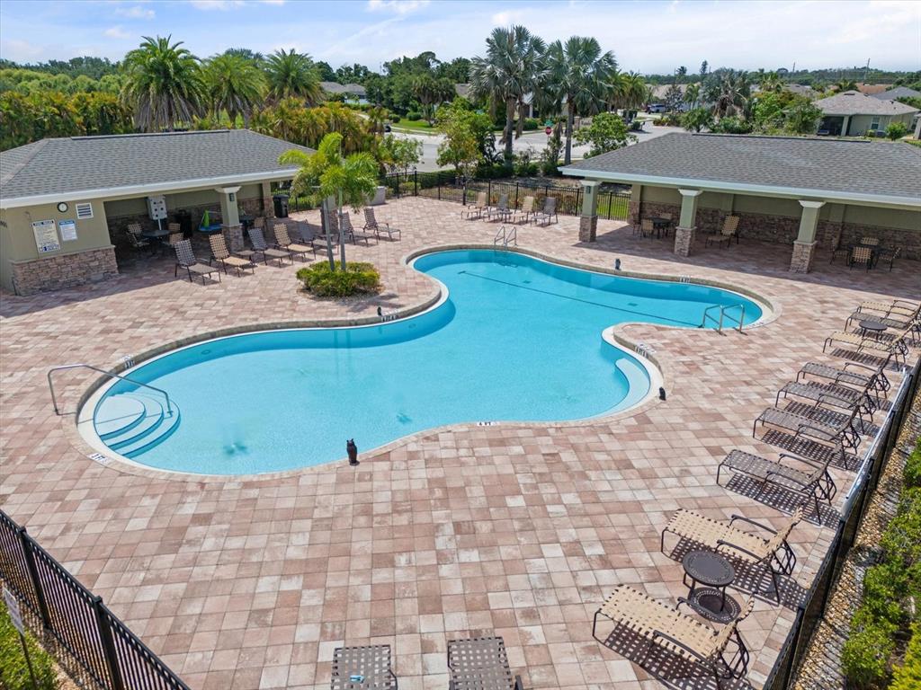 8932 Excelsior Place Venice, FL 34293 - Photo 40 of 43 a view of a swimming pool with seating space