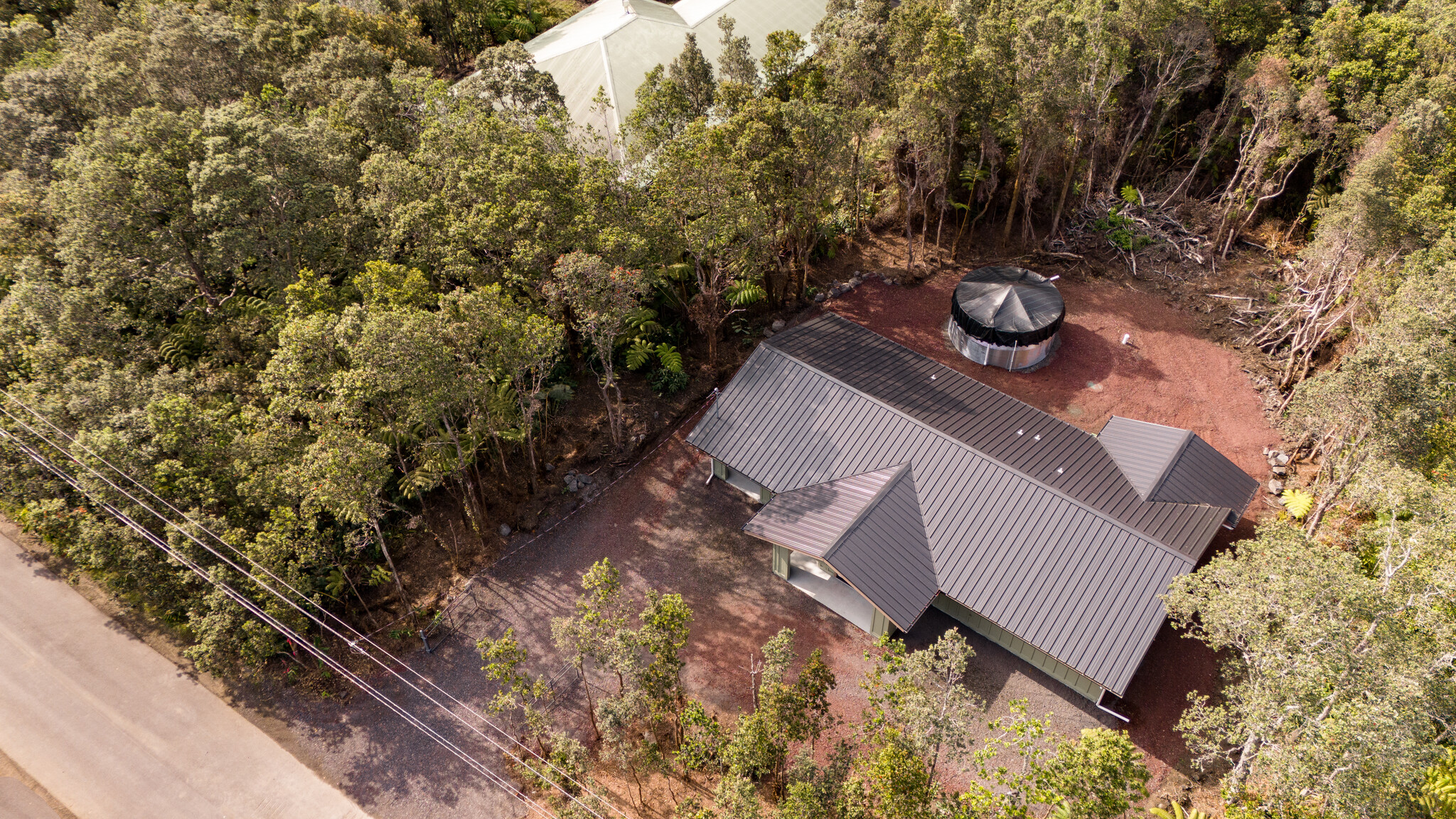 11-3790 9th Street Volcano, HI 96785 - Photo 28 of 30 a view of a backyard with chairs and tree