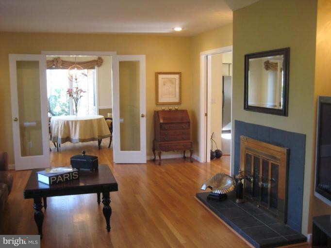 11597 Lake Newport Road Reston, VA 20194 - Photo 22 of 26 a living room with furniture and a wooden floor