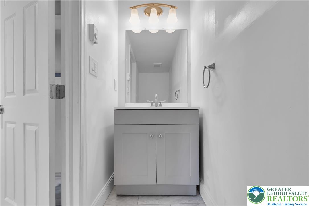 2246 2nd Street Wilson, PA 18042 - Photo 15 of 47 a bathroom with a sink and a mirror