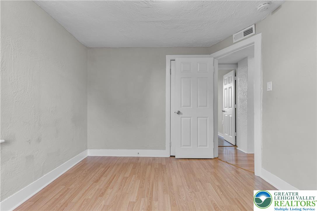 2246 2nd Street Wilson, PA 18042 - Photo 19 of 47 a view of an empty room and wooden floor