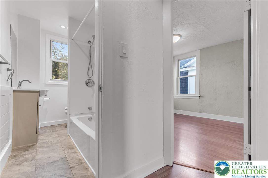 2246 2nd Street Wilson, PA 18042 - Photo 23 of 47 a bathroom with a sink and a mirror