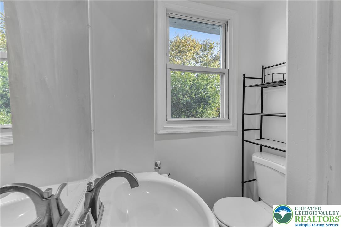 2246 2nd Street Wilson, PA 18042 - Photo 26 of 47 a bathroom with a sink toilet and vanity