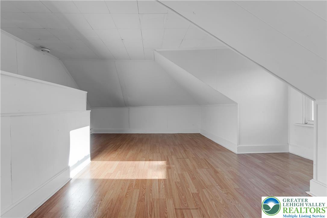 2246 2nd Street Wilson, PA 18042 - Photo 28 of 47 a view of an empty room and wooden floor