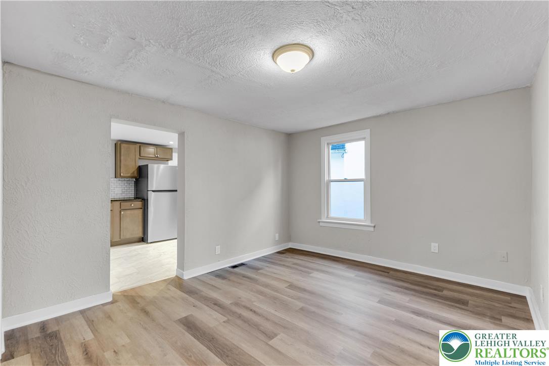 2246 2nd Street Wilson, PA 18042 - Photo 7 of 47 a view of empty room with wooden floor and fan