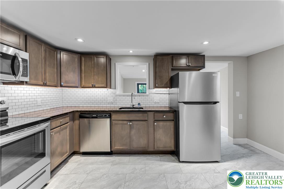 2246 2nd Street Wilson, PA 18042 - Photo 9 of 47 a kitchen with a refrigerator sink and microwave