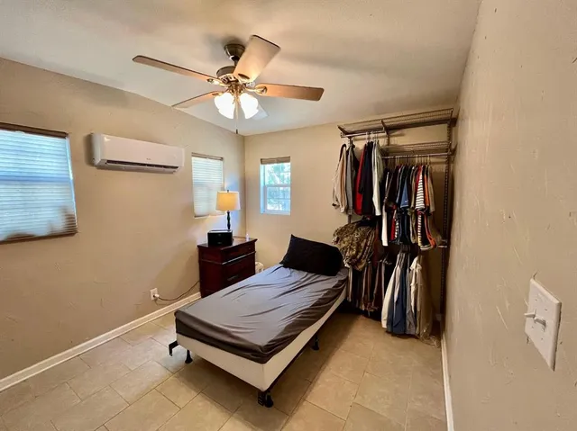 a bathroom with a sink toilet and mirror