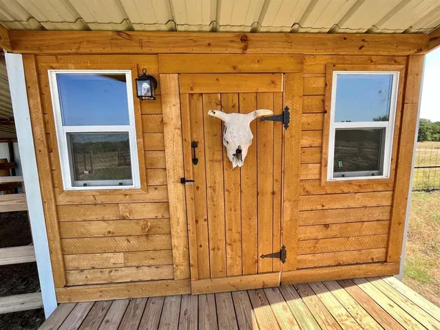 a view of outdoor space with wooden deck