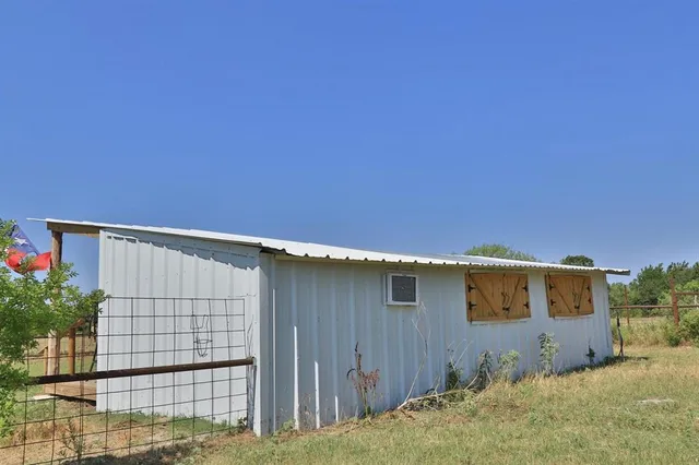 a view of a roof deck with wooden floor and fence