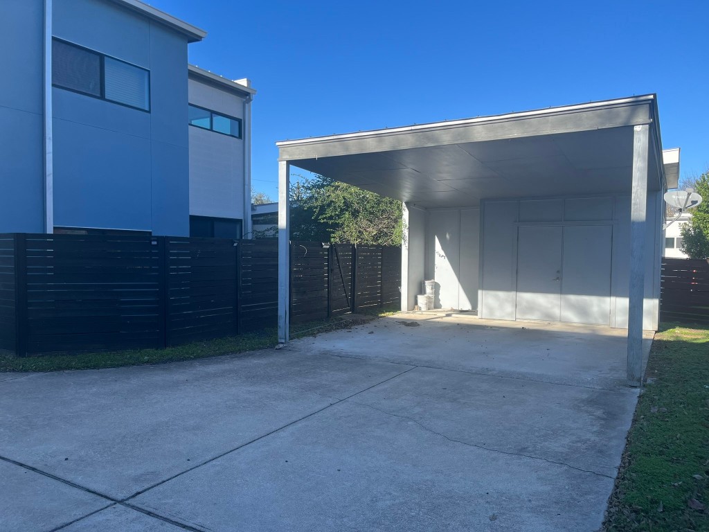 1105 Altum Street Austin, TX 78721 - Photo 13 of 16 a view of a house with a yard and garage