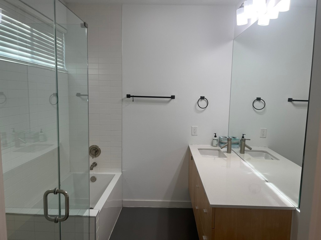 1105 Altum Street Austin, TX 78721 - Photo 6 of 16 a bathroom with a sink a toilet and shower