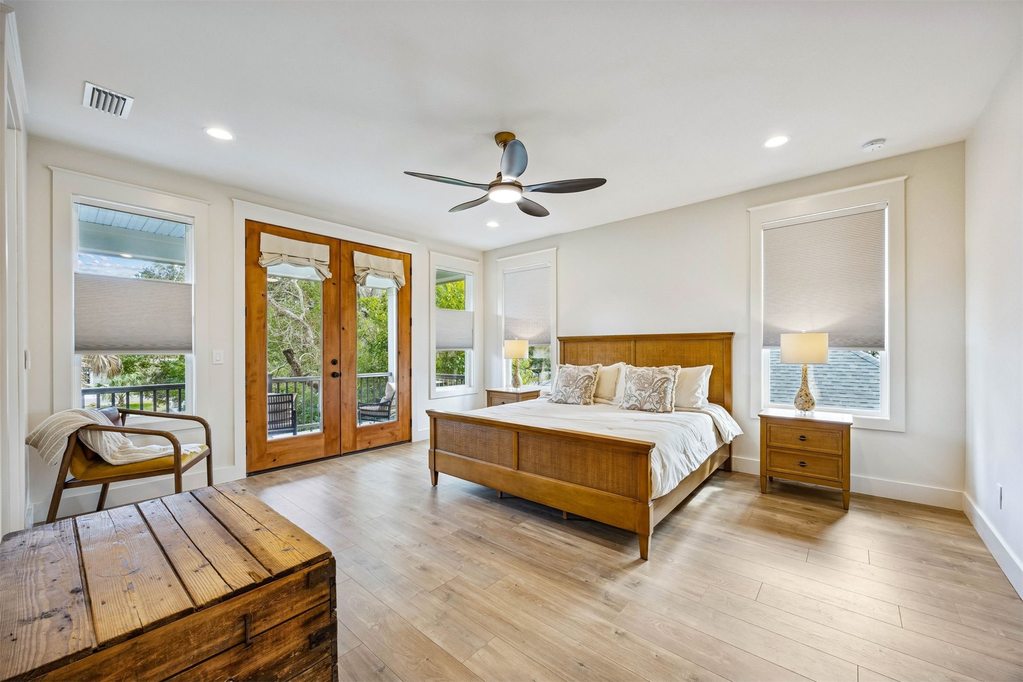 424 South 3rd Street Fernandina Beach, FL 32034 - Photo 17 of 38 a spacious bedroom with a bed and glass walk in closet