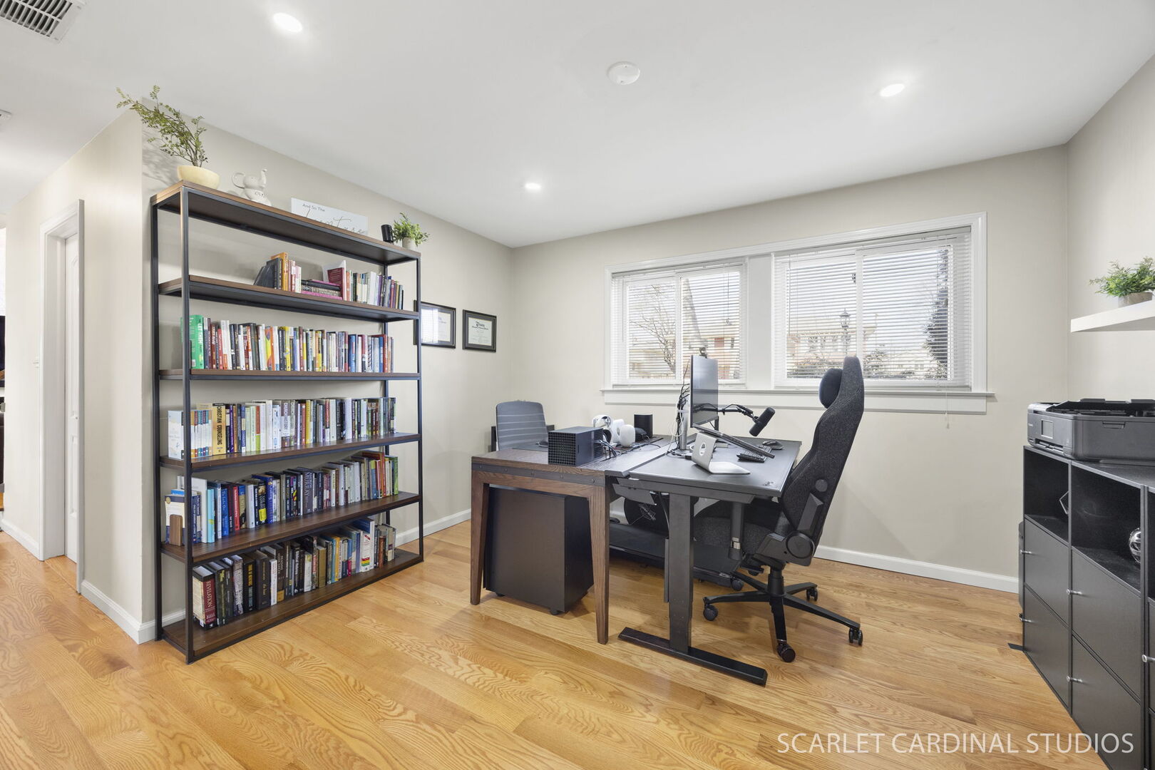 1003 East Alder Lane Mount Prospect, IL 60056 - Photo 12 of 35 a view of a workspace with furniture and a bookshelf