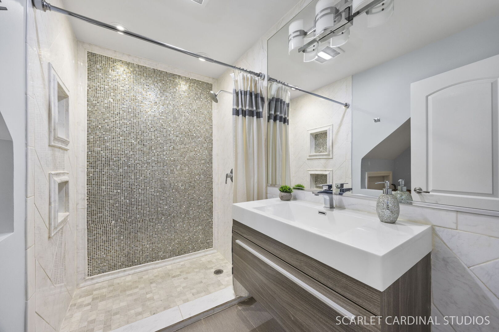 1003 East Alder Lane Mount Prospect, IL 60056 - Photo 22 of 35 a bathroom with a sink mirror and a shower