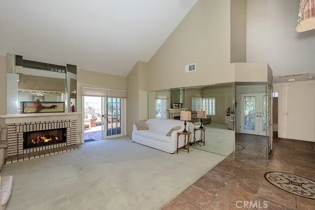 a living room with furniture and flowers