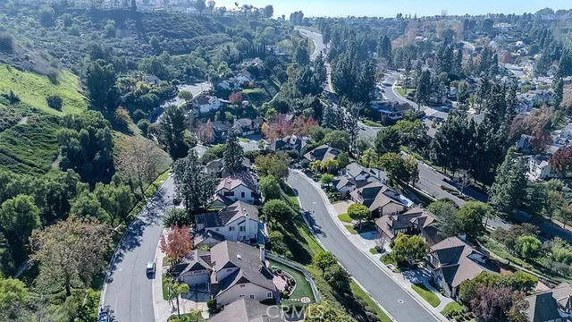 an aerial view of a residential apartment building with a yard